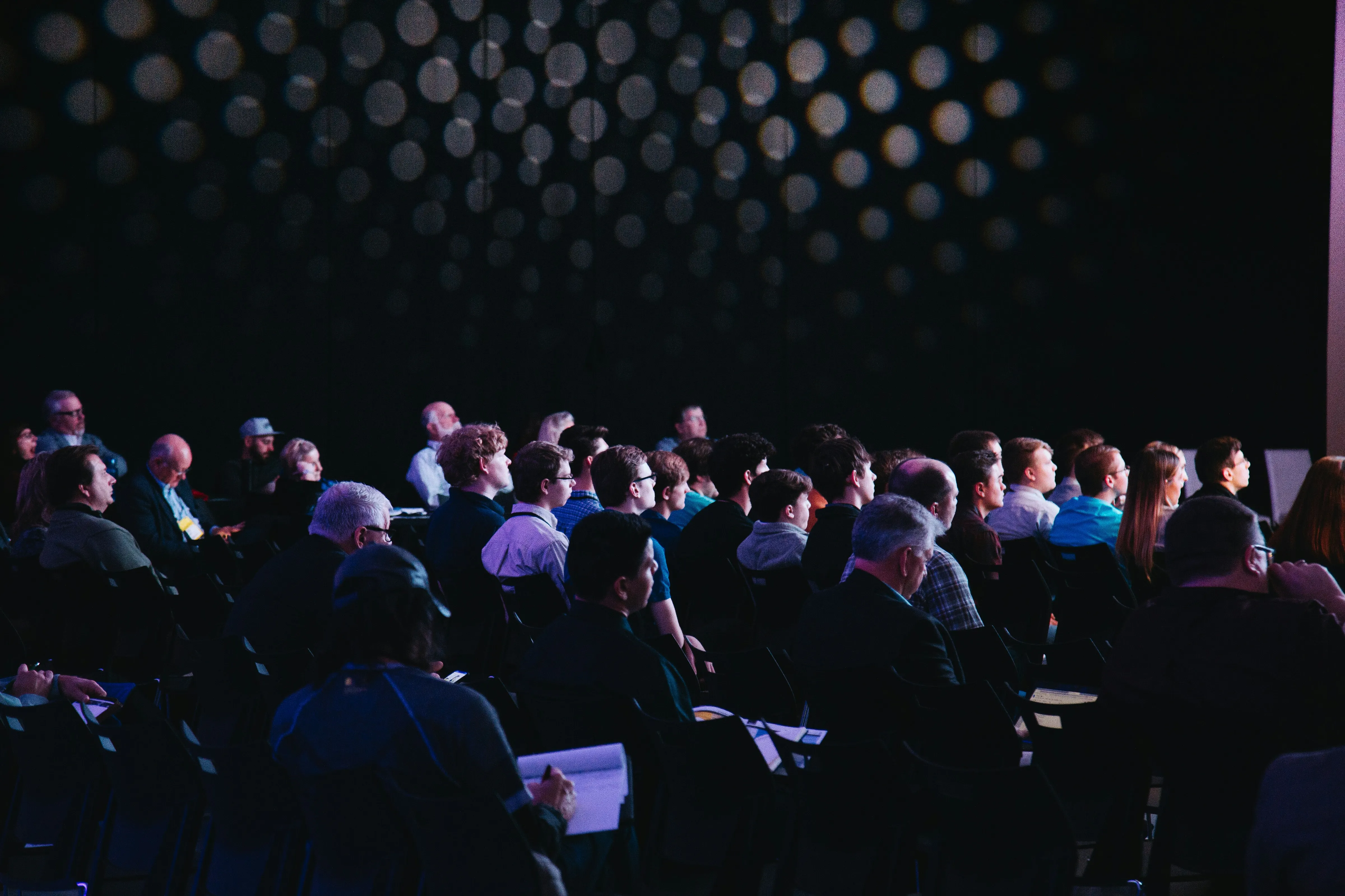 Rows of attendees seated at a hosted-buyer event